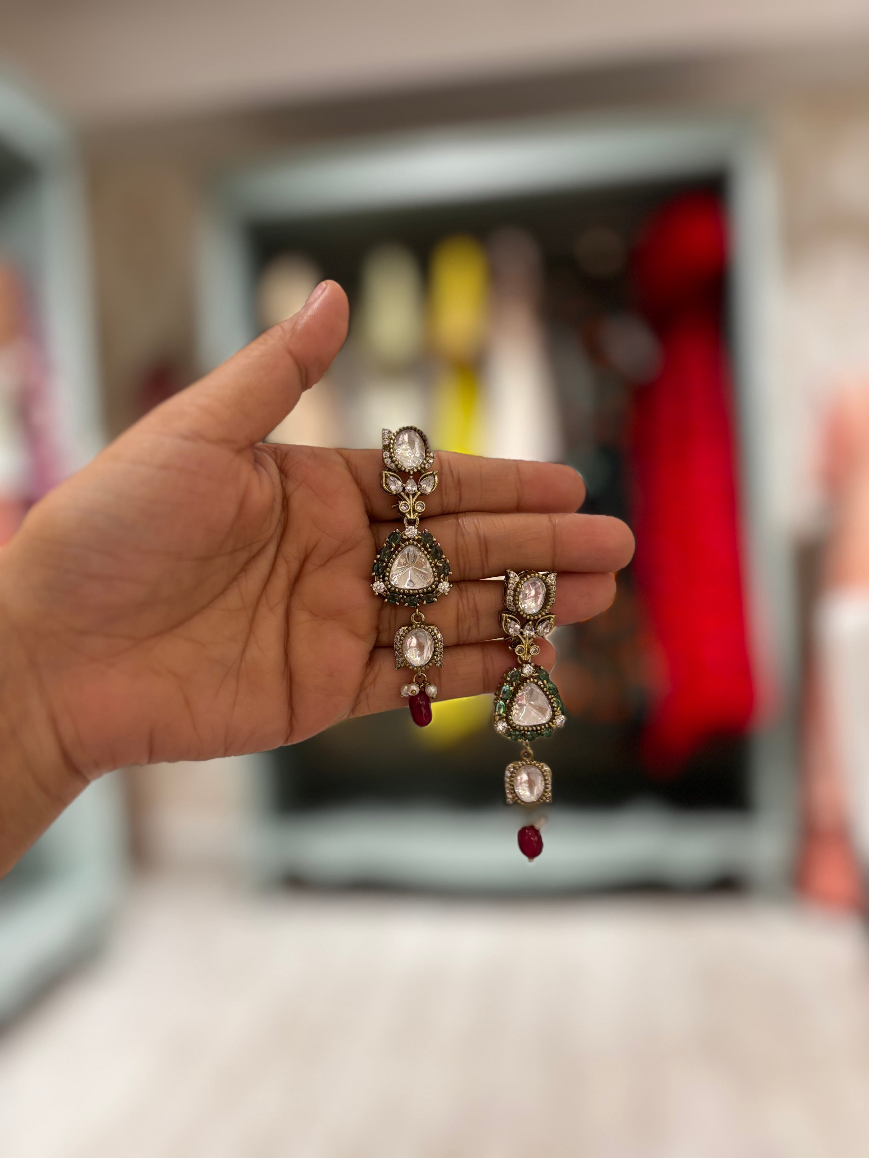 Victorian polki choker featuring emerald detailing and ruby bead drops in an antique finish.