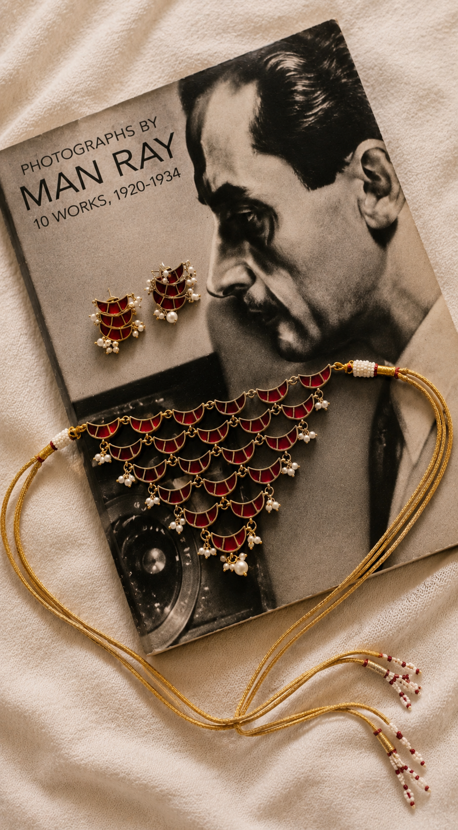 Layered crescent kundan choker set with pearl accents and matching stud earrings in antique gold finish