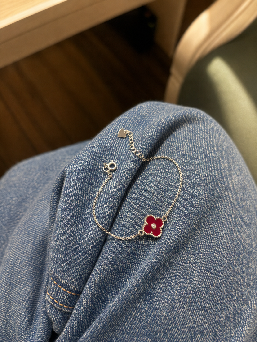 925 Sterling Silver Red Clover Bracelet for sister displayed in premium festive packaging, an elegant Raksha Bandhan gift from brother.