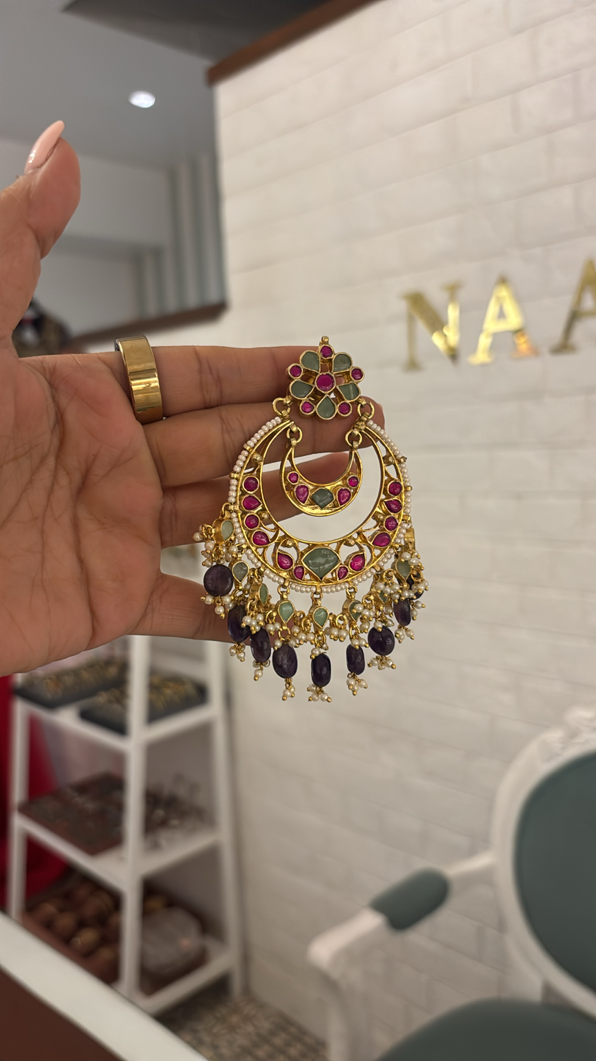 Royal meenakari chandbali earrings with pearl detailing, pink and green stones, and amethyst bead drops.
