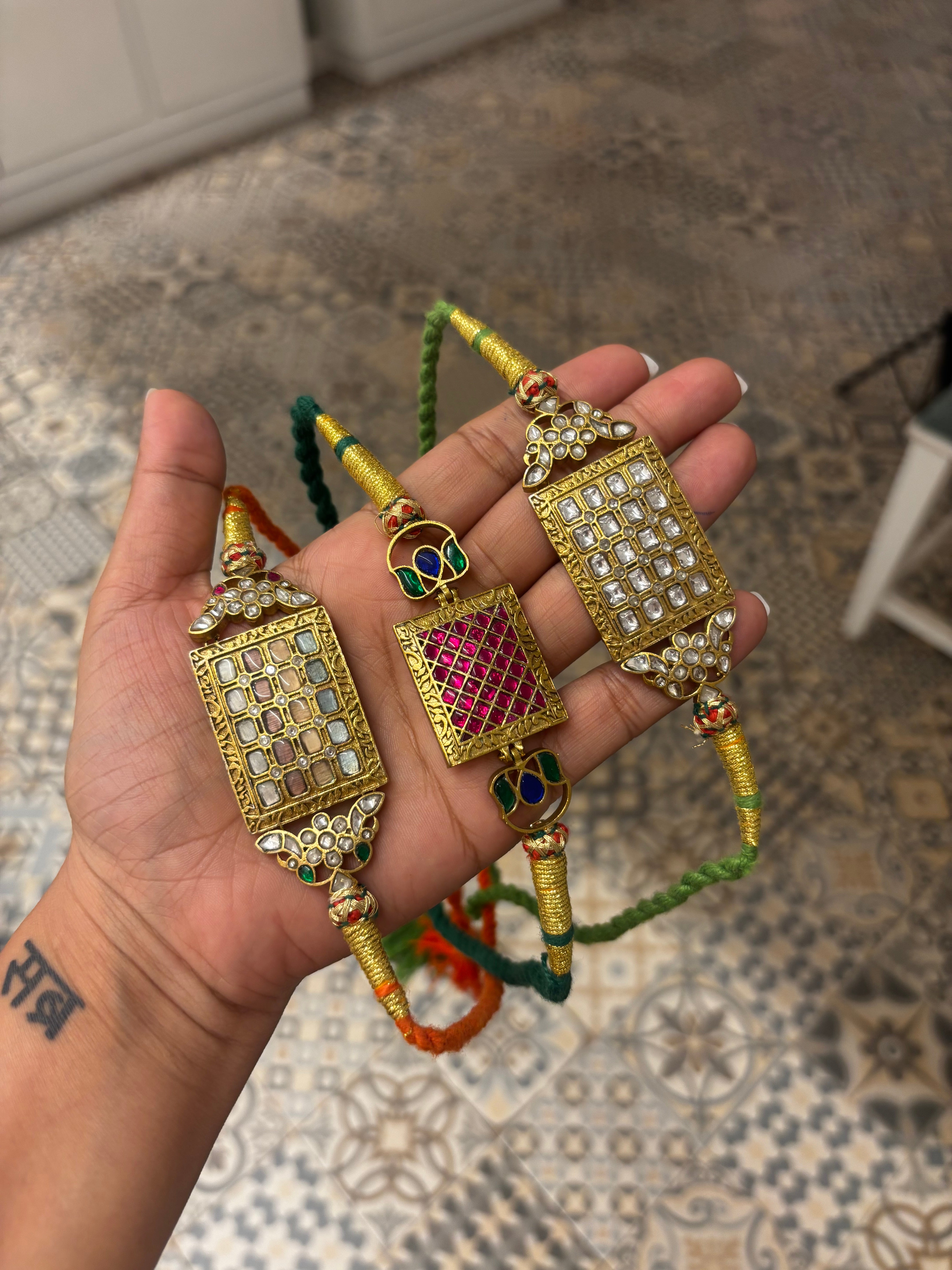 Gulnaar multicolour Kundan and Meenakari-inspired choker with red green stones and pearl detailing