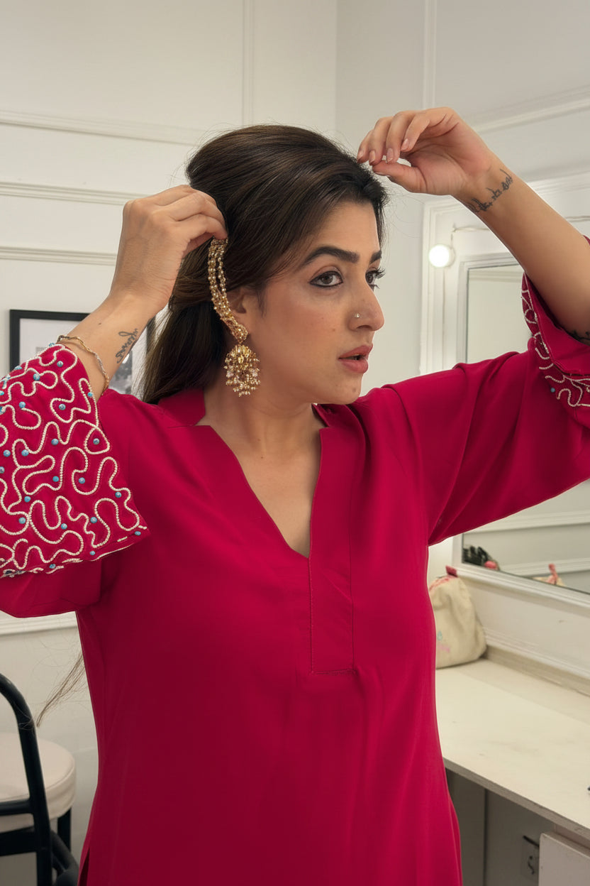 Aabroo pearl jhumka earrings with layered pearl strands and kundan detailing in a gold finish