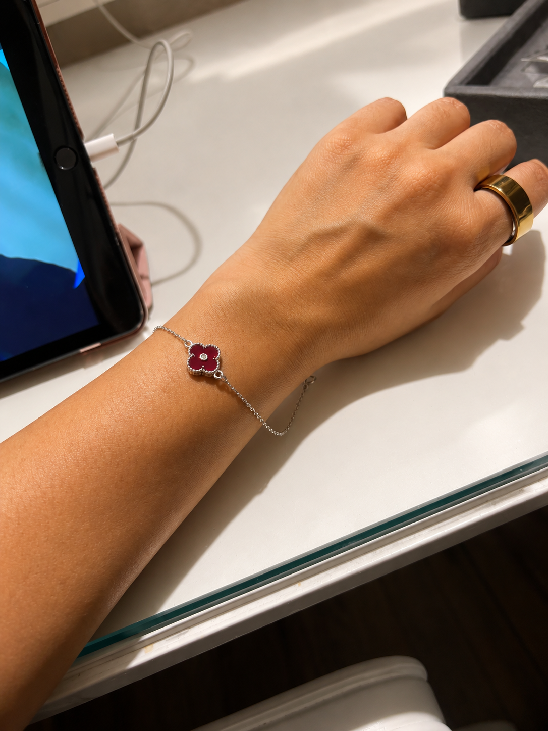 925 Sterling Silver Red Clover Bracelet for sister displayed in premium festive packaging, an elegant Raksha Bandhan gift from brother.